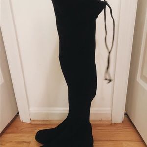 Tall black tie boots